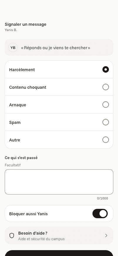 Écran « Signaler un message » de l’application Komi sur iPhone